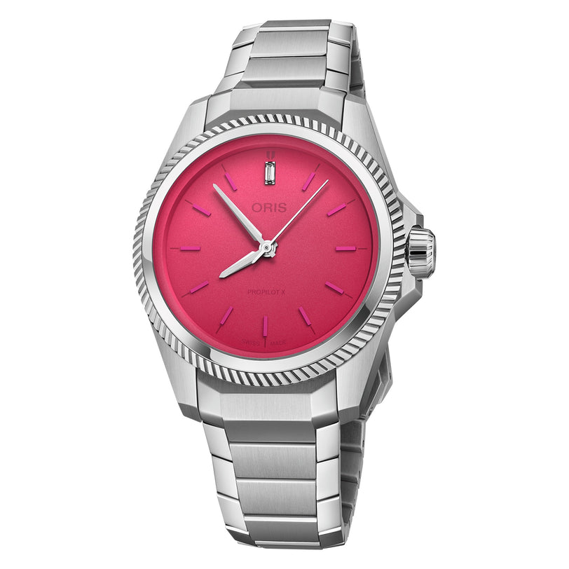 The Oris ProPilot X Miss Piggy Edition features a stainless steel case, hot pink dial, silver hands, baton markers, fluted bezel, and metal bracelet—a bold statement piece.