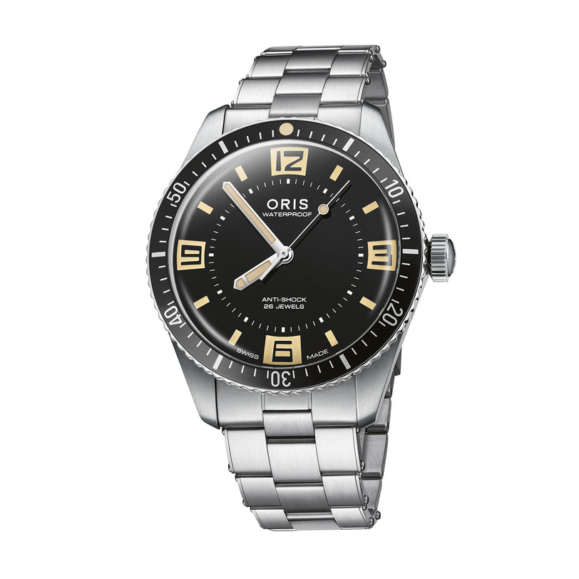 The Oris 60th Anniversary Edition is a stainless steel dive watch featuring a black dial, luminous hands and markers, date window at 6 o’clock, Swiss automatic movement, and rotating bezel.