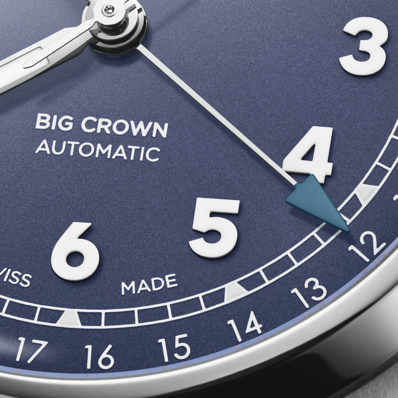 Close-up of the Oris Big Crown Pointer Dates lilac dial, showing numbers 3–6, a blue arrow at date 13, and BIG CROWN POINTER DATE AUTOMATIC. Powered by a Swiss Made automatic mechanical movement.