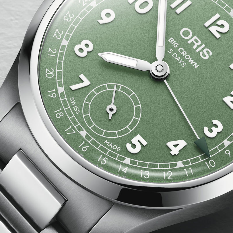 Close-up of the Oris Big Crown Pointer Date Calibre 403 watch face, highlighting Swiss craftsmanship with silver hands, Arabic numerals, stainless steel bracelet, and the classic Pointer Date design powered by the Calibre 403 movement.