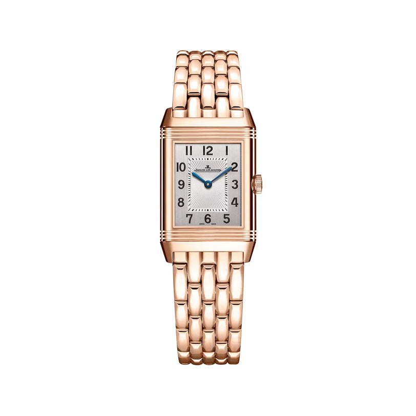 The Jaeger-LeCoultre Reverso Classic Duetto features a rectangular pink gold case, woven metal band, silver dial with black numerals, and blue sword-shaped hands, shown on a white background.