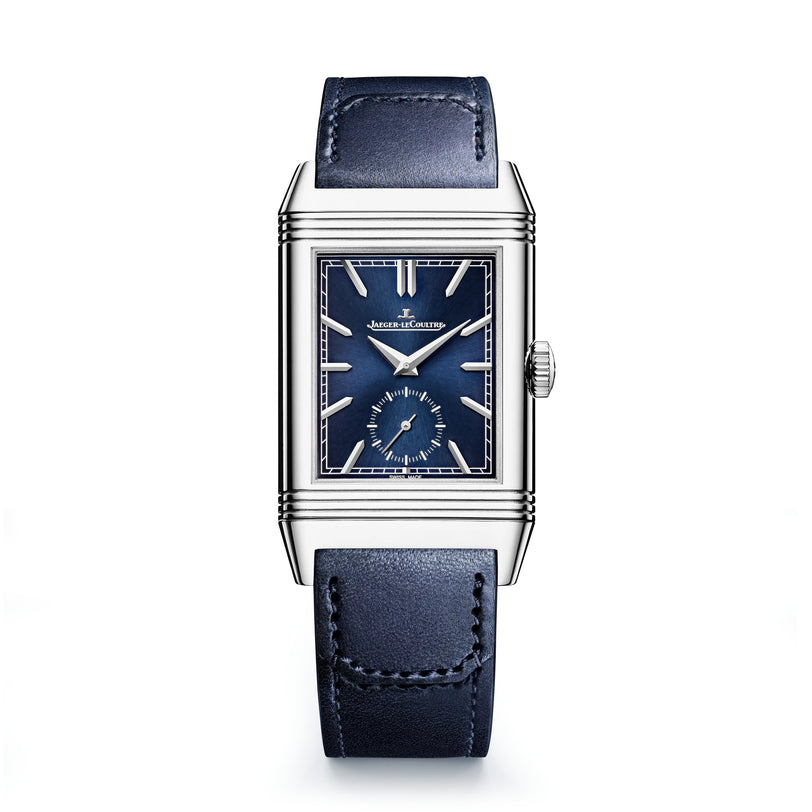 The Jaeger-LeCoultre Reverso Tribute Duoface Small Seconds is a rectangular stainless steel watch with a blue dial, leather strap, Art Deco design, logo display, and a small seconds subdial at 6 o’clock.