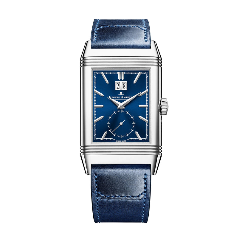 The Jaeger-LeCoultre Reverso Tribute Geographic is a rectangular Art Deco-style watch featuring a blue face, silver casing, blue leather strap, and top-dial date display.