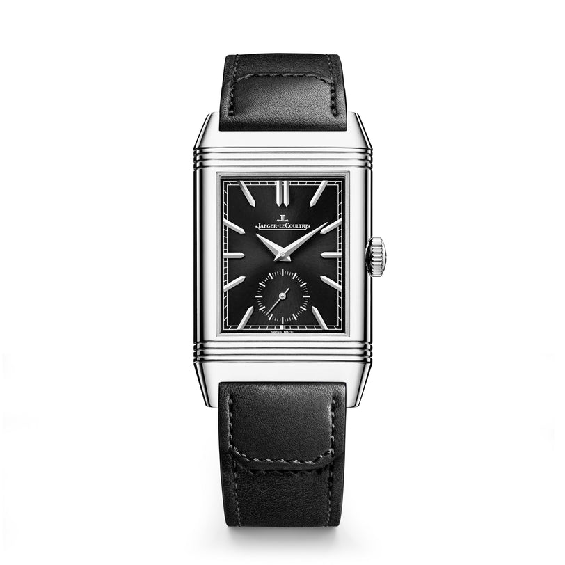 The Jaeger-LeCoultre Reverso Tribute Duoface Small Seconds is a rectangular steel watch with a black dial, silver hands and markers, small seconds subdial, and a sleek black leather strap.