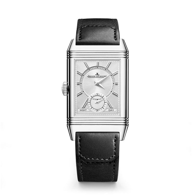 The Jaeger-LeCoultre Reverso Tribute Duoface Small Seconds features a rectangular steel case, black leather strap, silver dial, small seconds subdial, day-night indicator, and an elegantly displayed Jaeger-LeCoultre logo.