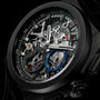 Close-up of Zenith Defy El Primero 21, a black skeleton-style wristwatch with visible gears, high-frequency chronograph subdials, and luminous hands, highlighting its intricate mechanical details.