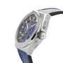 The Zenith Defy El Primero 21 features a titanium case, open-worked blue and black dial with visible gears, and a blue leather strap, displayed at an angled side view.
