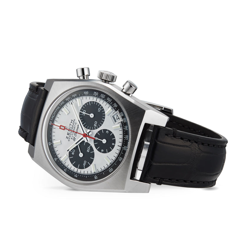 The Zenith Chronomaster Revival El Primero A384 is a stainless steel chronograph with a black leather strap, white dial, three black subdials, a date window at 4:30, and the iconic El Primero movement.