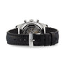 The Zenith Chronomaster Revival El Primero A384 is a mechanical wristwatch with a black leather strap, visible El Primero movement through the caseback, and a sleek silver buckle.