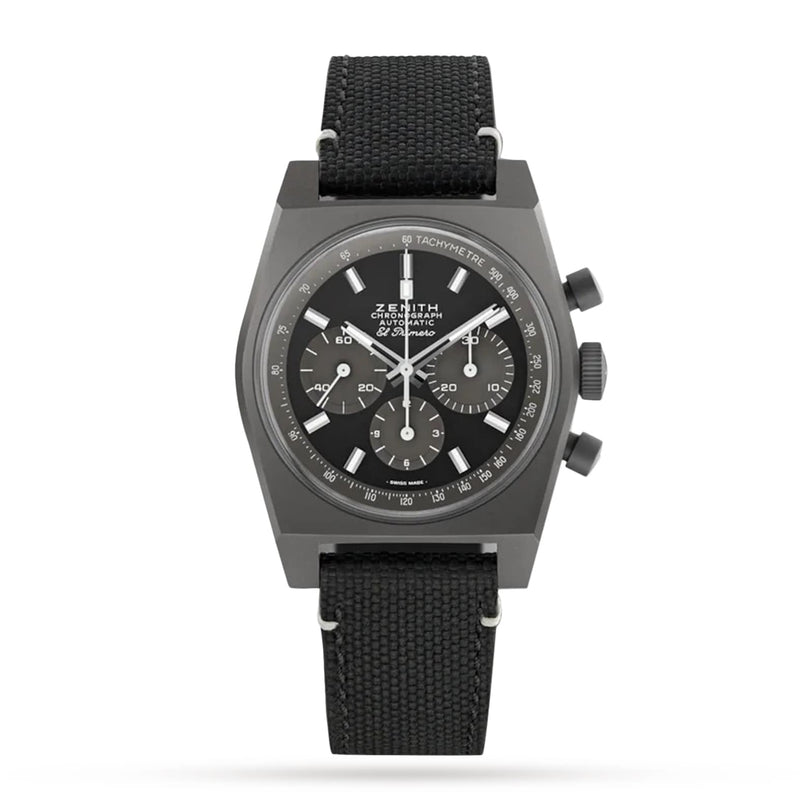 The Zenith Chronomaster Revival Shadow is a black chronograph wristwatch with a matte titanium case, three subdials, white markers, and a black fabric strap, shown against a plain white background.