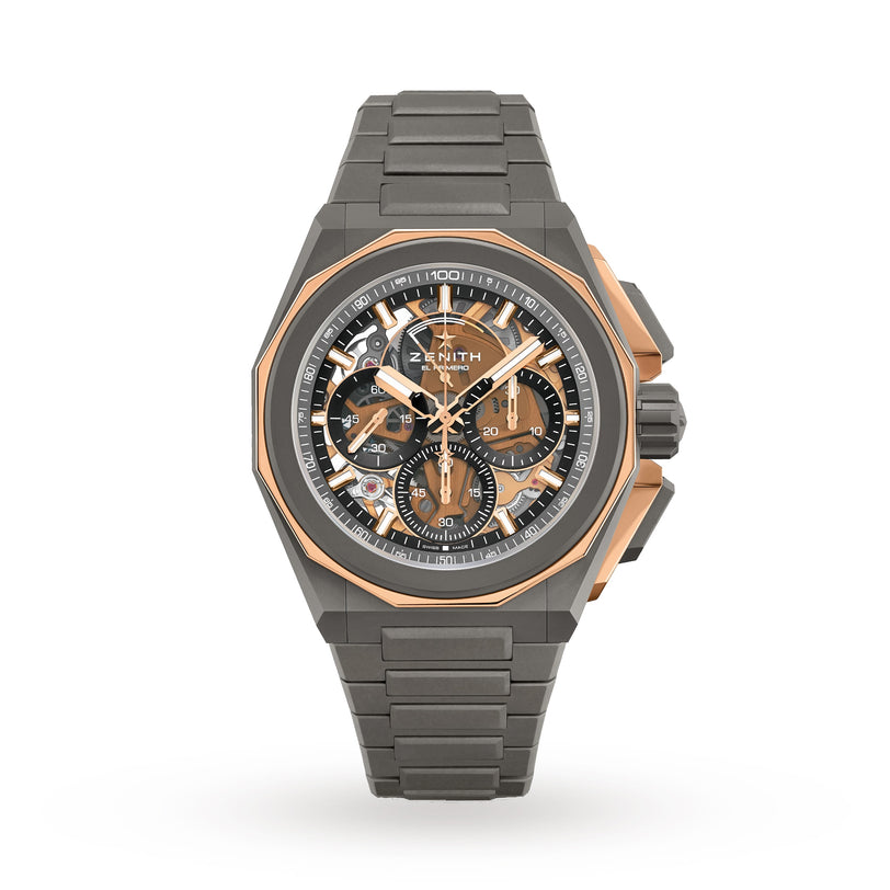 The Zenith Defy Extreme is a luxury mens wristwatch with a grey metal band, gold accents, skeleton dial, and chronograph.