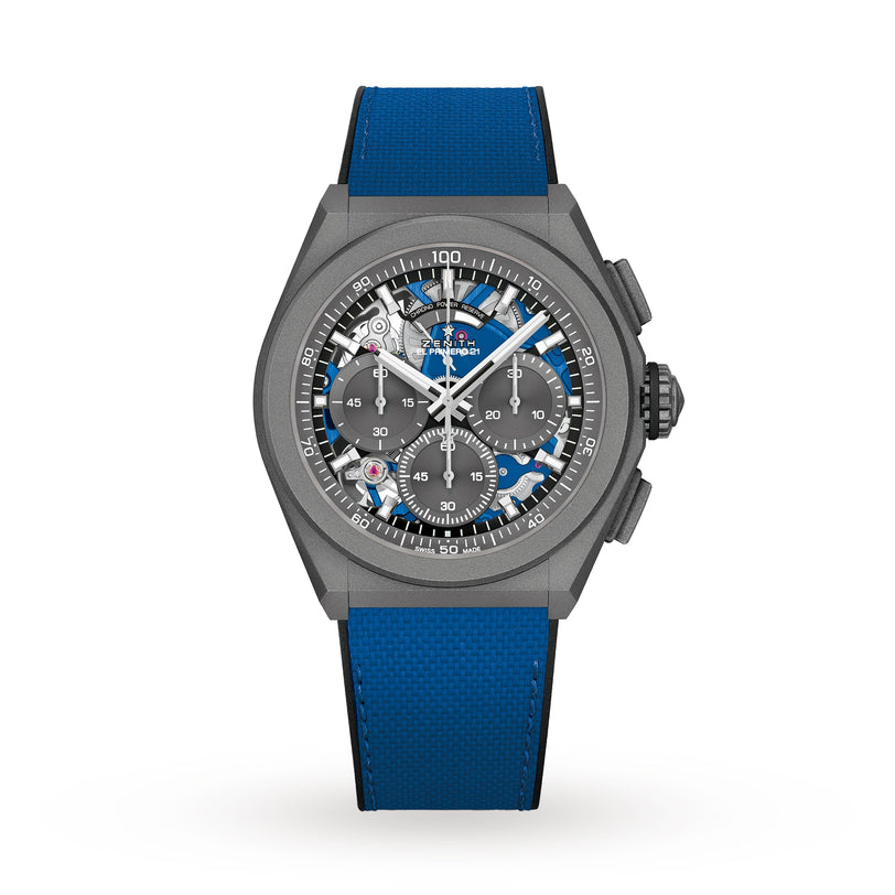 The Zenith Defy 21 Ultrablue is a modern skeleton watch featuring a blue strap, black case, and exposed gears on the dial.