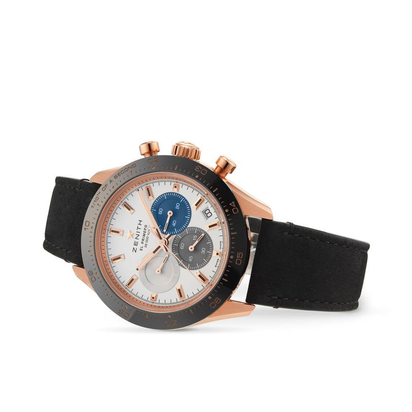 The Zenith Chronomaster Sport features an 18K rose gold case, black leather strap, white dial with blue and grey accents, and three subdials—an elegant luxury watch powered by the El Primero 3600 movement.