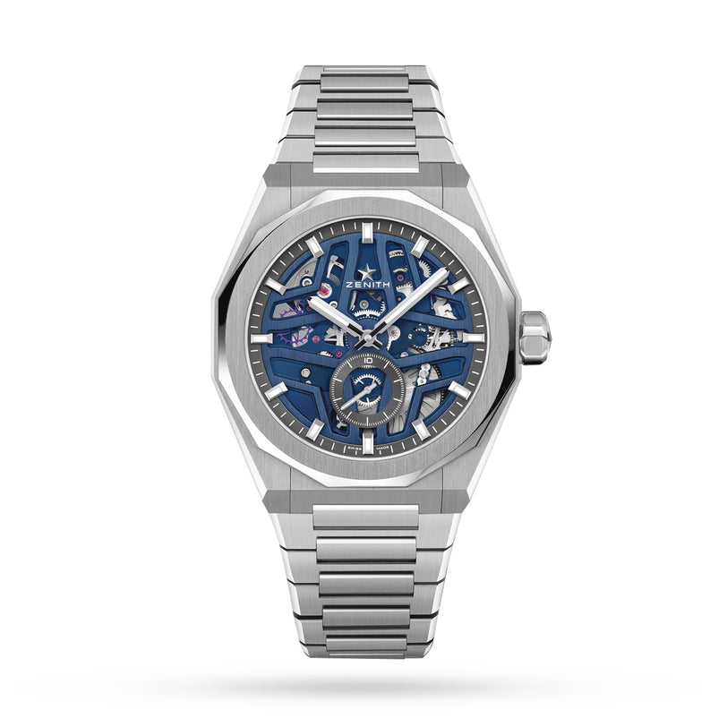 The Zenith Defy Skyline Skeleton wristwatch features a blue skeleton dial, silver indices, exposed movement, and a metal bracelet, capturing urban sophistication in stainless steel—shown against a white background.