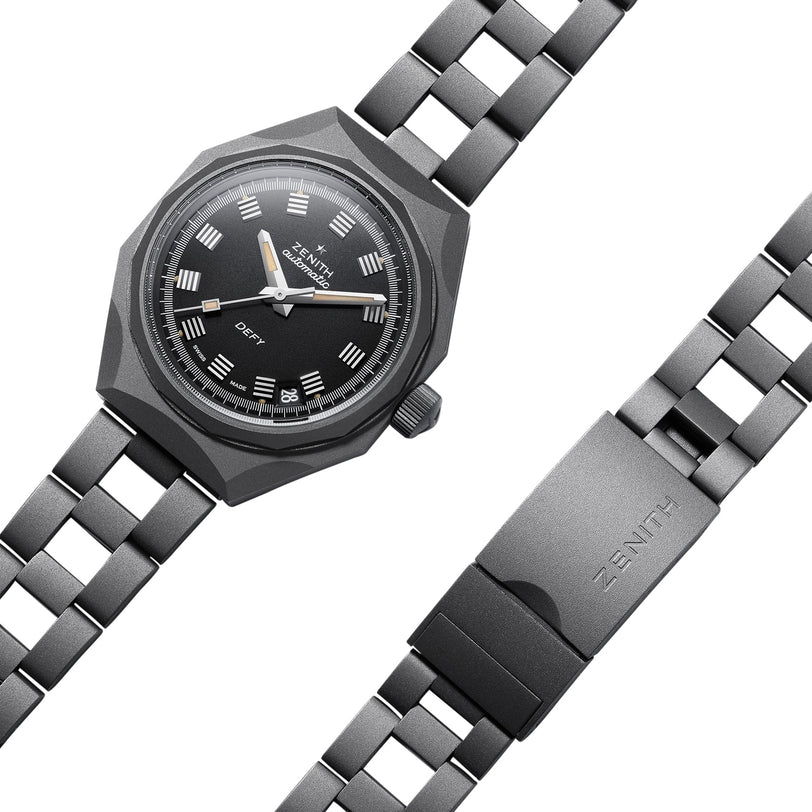 The Zenith Defy Revival Shadow wristwatch features a black dial, octagonal bezel, silver hour markers, titanium case, and a matching metal bracelet with a ZENITH-engraved clasp.