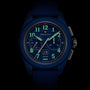 The Zenith Limited Edition Pilot Big Date Flyback 160th Anniversary wristwatch features a blue dial, luminous hands and numerals, two subdials, a date window at 6 o’clock, and a fabric strap, displayed on a black background.