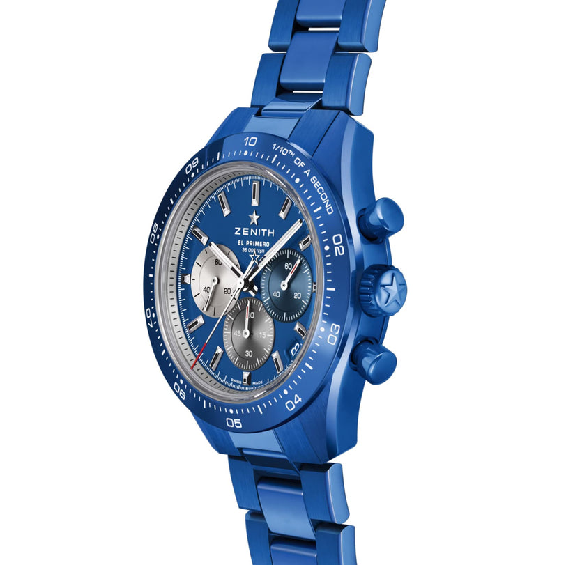 A blue Zenith Limited Edition Chronomaster Sport 160th Anniversary Edition chronograph wristwatch with a metal bracelet, three subdials, and a tachymeter bezel is pictured at an angle against a white background.