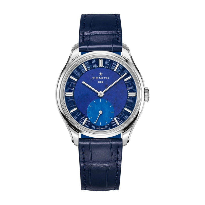 The Zenith Limited Edition G.F.J. Calibre 135 160th Anniversary Edition wristwatch features a blue leather strap, blue dial with silver indices, platinum round case, and a subdial at 6 o’clock, shown against a white background.