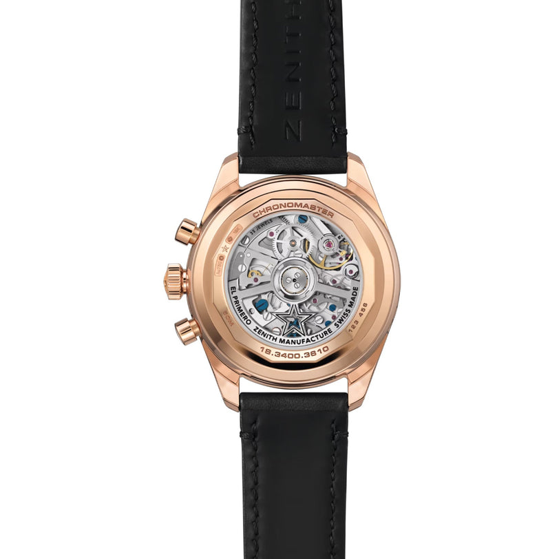 The Zenith Chronomaster Original features a rose gold case, a black leather strap, and an intricate transparent mechanical back.