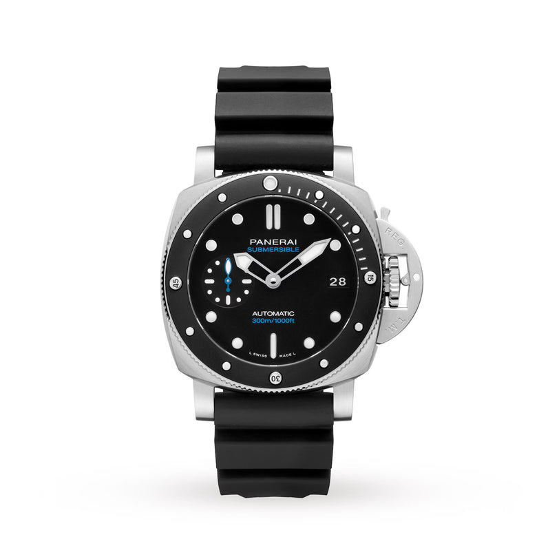 The Panerai Submersible is a 42mm stainless steel men's dive watch with a black dial, luminous markers, date display, and black rubber strap. It features a distinctive crown guard on the right side.