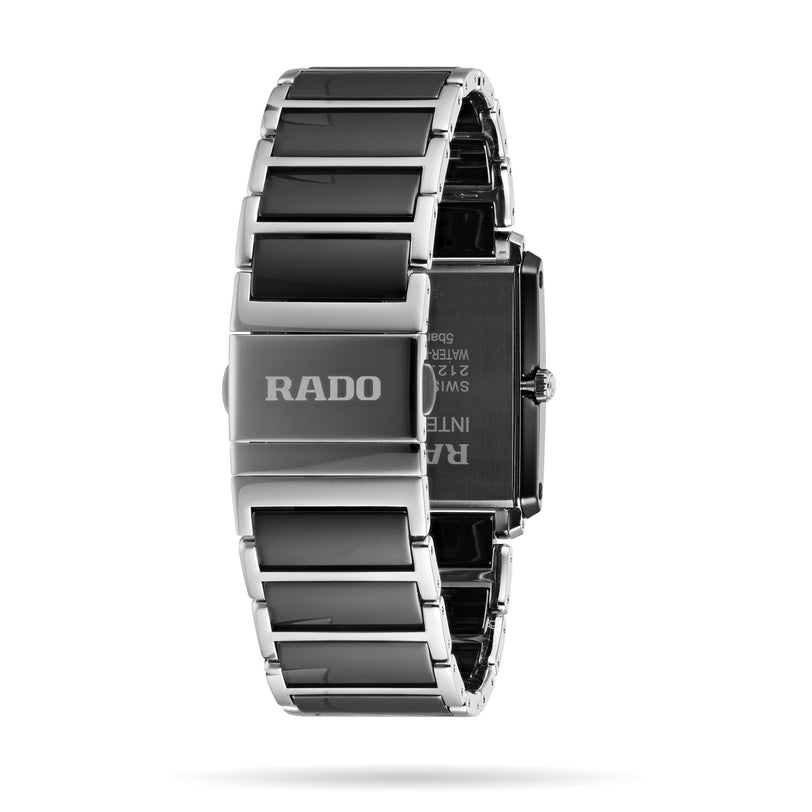 A close-up of the Rado Integral Diamonds watch, showcasing its stainless steel and high-tech ceramic bracelet with the Rado logo engraved on the clasp.