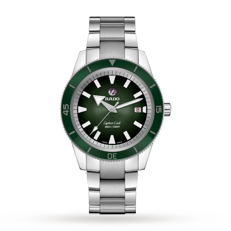 A Rado Captain Cook Automatic watch is shown on a white background, featuring vintage details with a green bezel and dial, silver hour markers, and a date display at 3 o’clock.