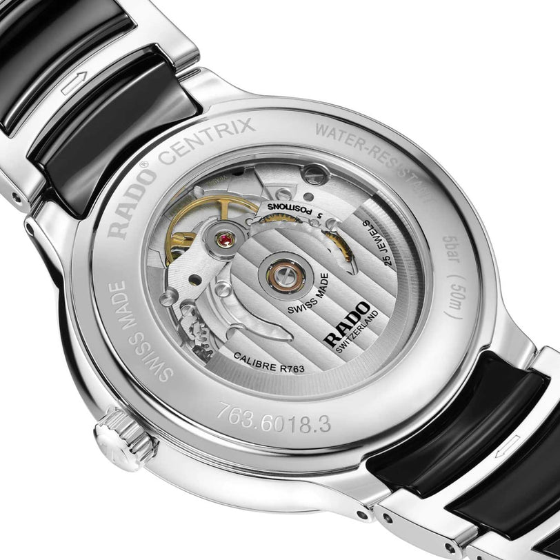 Close-up of the back of the Rado Centrix Automatic Diamonds watch, displaying its automatic movement through a transparent sapphire crystal case back and emphasizing its high-tech ceramic build.