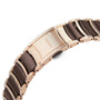 Close-up of a Rado Centrix watch bracelet, showcasing rose gold and black ceramic links with the Rado logo engraved on the clasp.