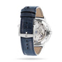 A close-up of the Ulysse Nardin Marine Torpilleur watch highlights its mechanical movement and branded clasp, paired with a blue leather strap.