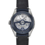 Close-up of the back of the Ulysse Nardin Freak X Ti Blue, highlighting its automatic movement, rotor, and engraved details on the metal case and rim.
