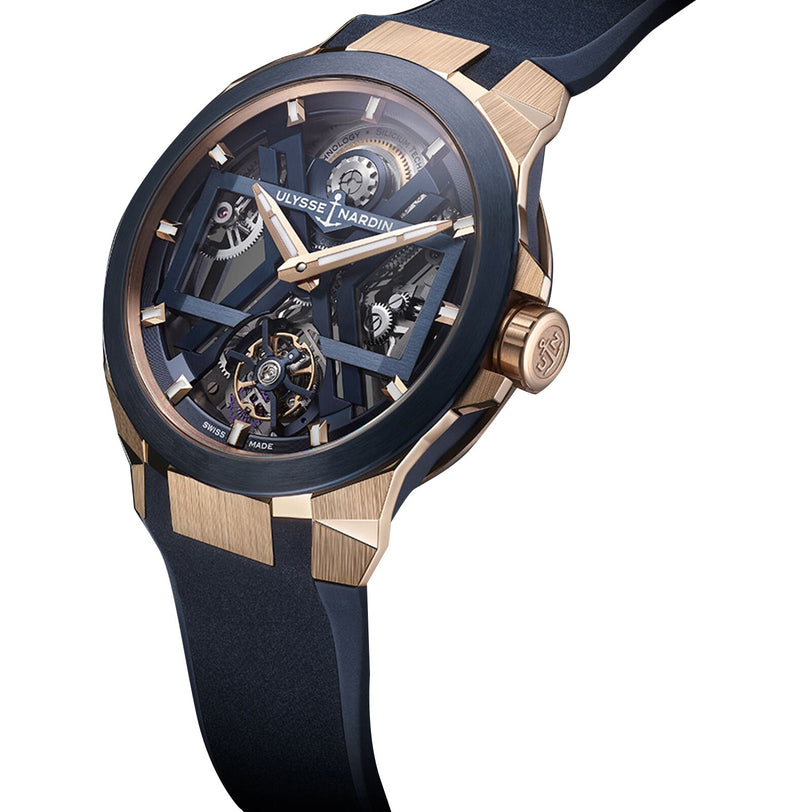 The Ulysse Nardin Blast Tourbillon features a blue strap, exposed mechanical gears, and rose gold accents on the bezel and case—showcasing exceptional Haute Horology craftsmanship.
