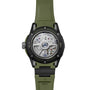 Back view of the Ulysse Nardin Diver NET OPS with a green strap, revealing its exposed mechanical movement and engraved case, reflecting the brand’s commitment to sustainability with innovative materials.