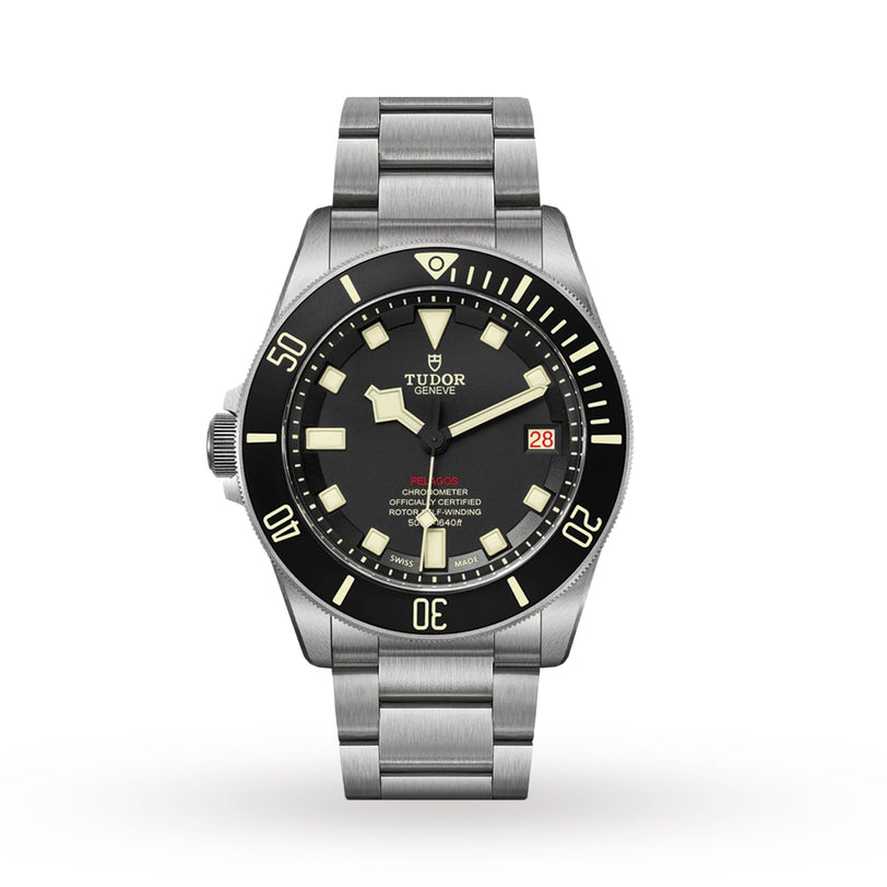 The TUDOR Pelagos LHD divers watch features a stainless steel case, black bezel and dial with luminous markers, date display at 3 oclock, and is shown on a metal bracelet against a white background.