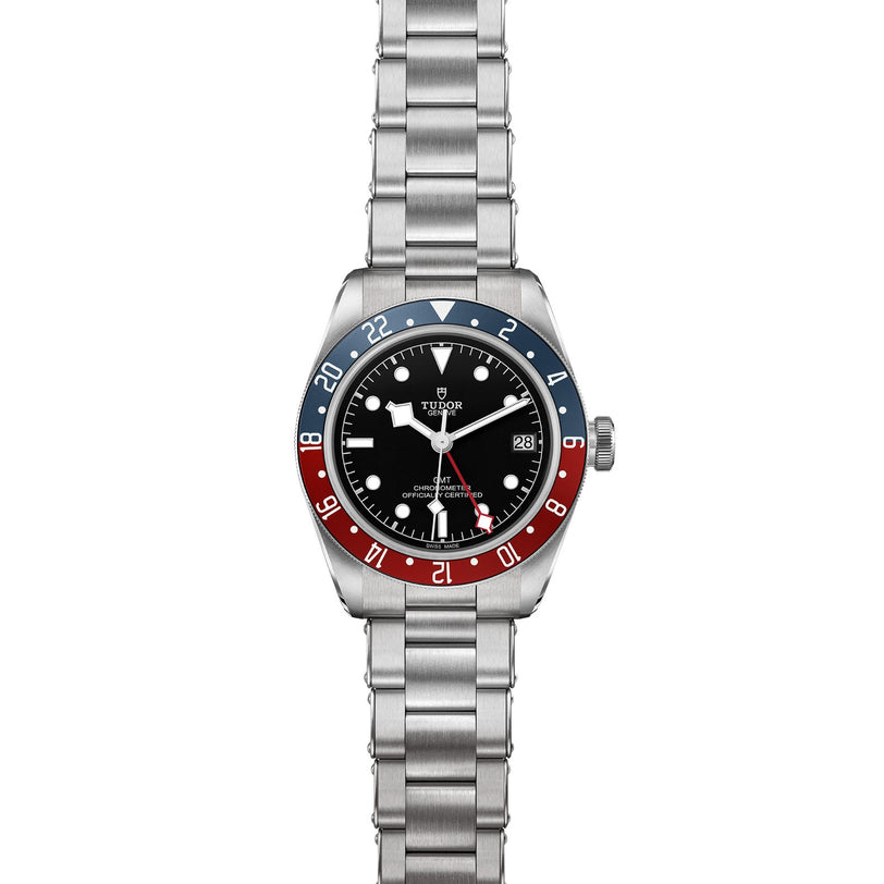 The TUDOR Black Bay GMT is a stainless steel wristwatch featuring a black dial, date display, and blue-red bezel on a metal bracelet—an eye-catching model inspired by classic diving watches.