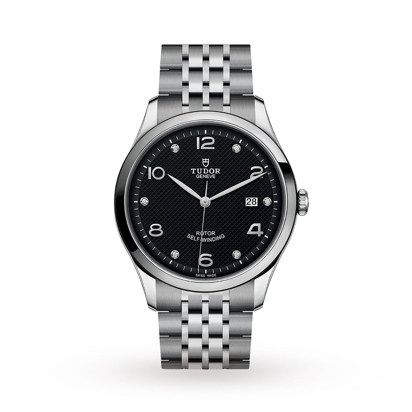 The TUDOR 1926 wristwatch features a silver case, black dial with diamond hour markers, date window, and a metal bracelet band.