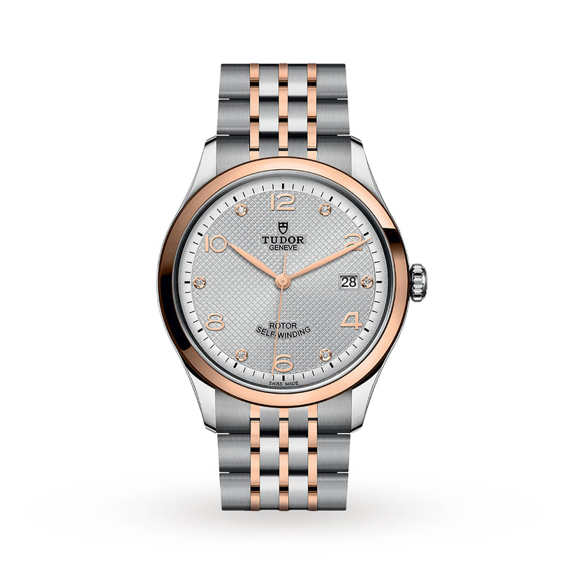 The TUDOR 1926 watch features a silver and rose gold band, white textured dial, date at 3 o’clock, and rose gold bezel, hands, and markers—an elegant mechanical timepiece for discerning enthusiasts.