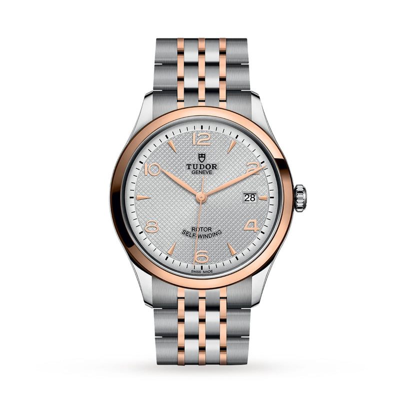 The TUDOR 1926 wristwatch features a silver textured dial, gold markers and hands, date at 3 oclock, and a two-tone bracelet—a classic mechanical choice for watch enthusiasts.