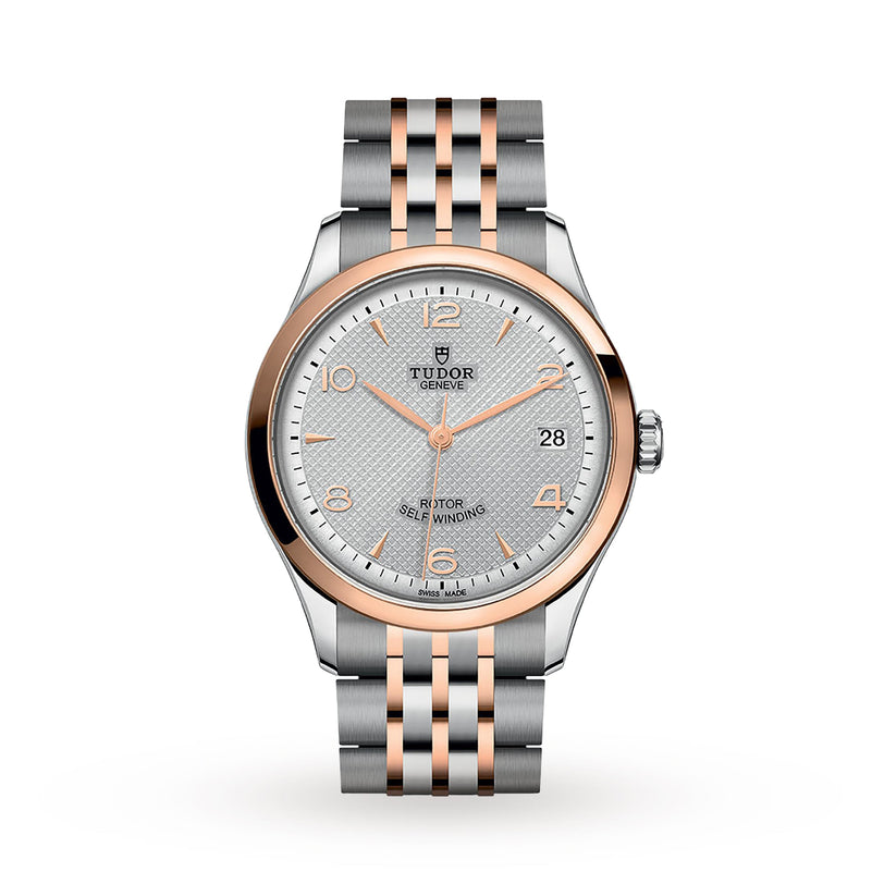 The TUDOR 1926 features a silver and rose gold metal band, white textured dial, date at 3 oclock, and gold markers and hands—an elegant mechanical watch for discerning enthusiasts.