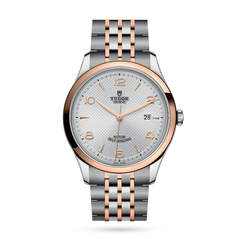 The TUDOR 1926 features a silver and rose gold two-tone band, a white patterned dial, gold hour markers, and a date window at 3 o’clock—an elegant mechanical watch for timeless style.