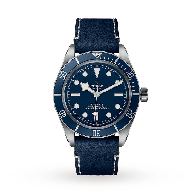 The TUDOR Black Bay 58 diving watch features a unidirectional blue bezel, blue dial with white markers, and a matching blue leather strap, all showcased against a crisp white background.