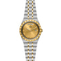 The TUDOR Royal wristwatch features a gold dial with day and date display, gold Roman numerals, and a two-tone stainless steel and gold bracelet for a refined sport-chic style.