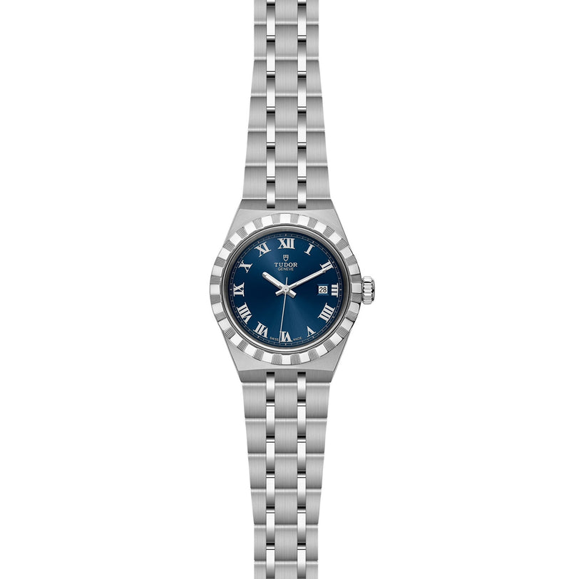 A TUDOR Royal wristwatch in silver featuring a blue dial, Roman numerals, and a metal link bracelet.