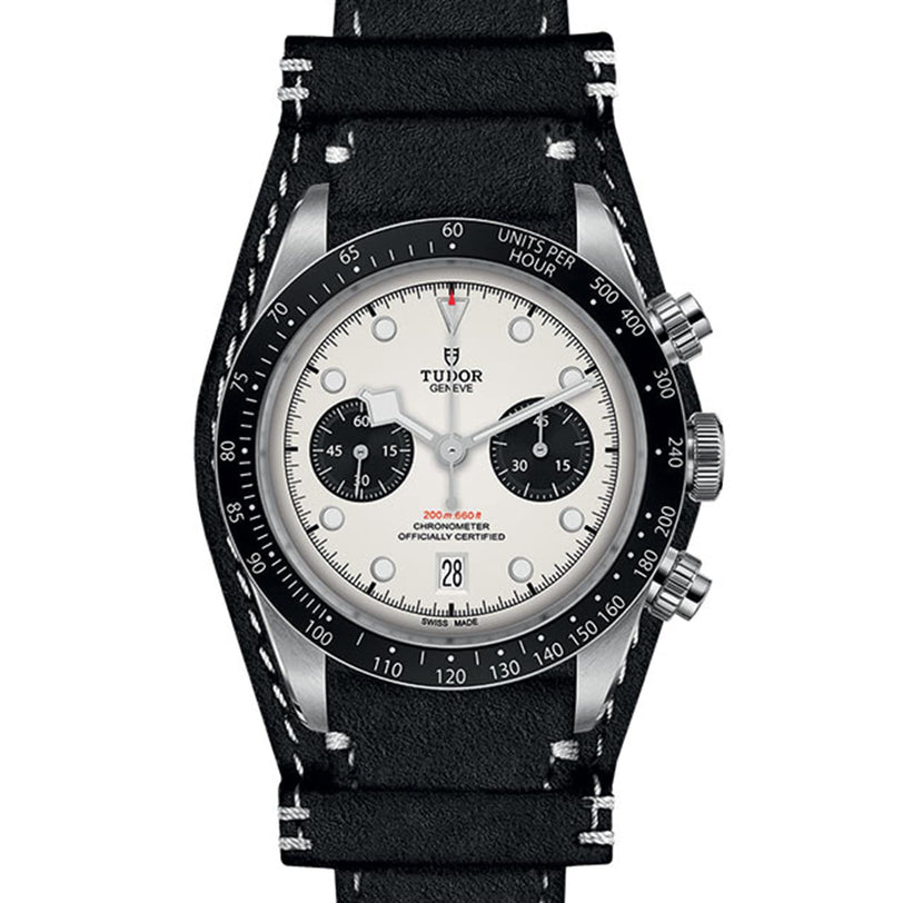 The TUDOR Black Bay Chrono wristwatch features a white dial with black subdials and comes with a black leather strap.