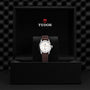 The TUDOR 1926 wristwatch features a white dial and brown leather strap, elegantly presented in a black box with the TUDOR logo—an ideal choice for admirers of classic timepieces.
