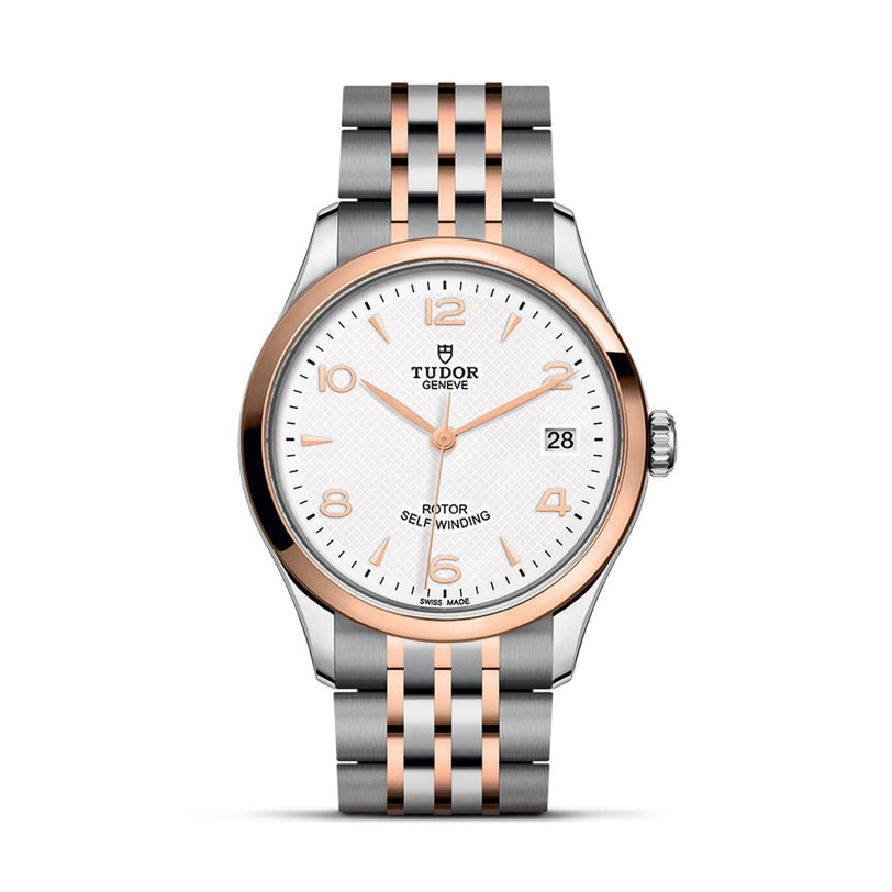 The TUDOR 1926 wristwatch features a silver and rose gold two-tone metal band, white dial, date window at 3 o’clock, and matching hour markers—crafted by the brand founded by Rolex’s creator and known for reliable mechanical timepieces.