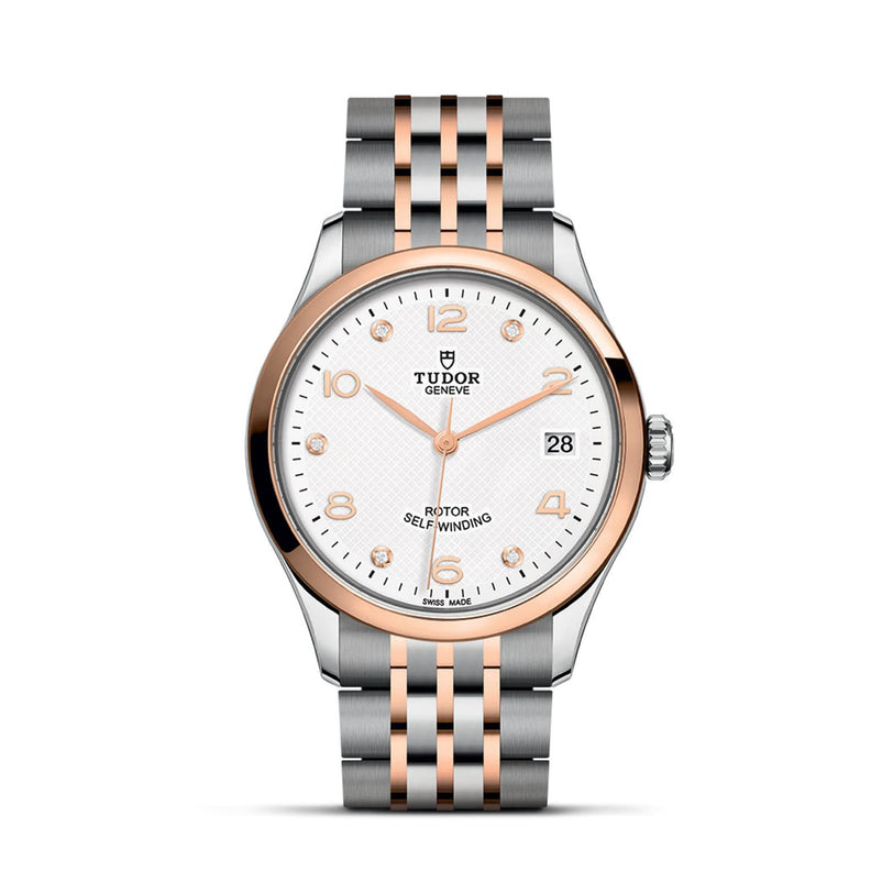 The TUDOR 1926 wristwatch features a silver and rose gold metal band, white dial, gold hour markers, date display at 3 o’clock, and “TUDOR Geneve” branding—ideal for fans of classic elegance.