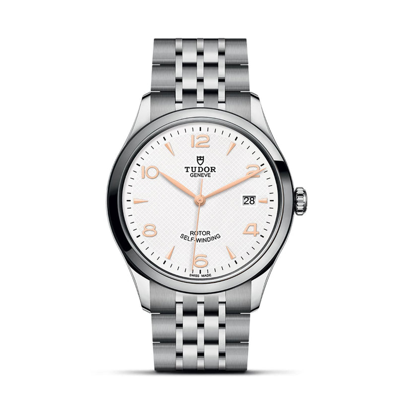 The TUDOR 1926 is a timeless stainless steel wristwatch featuring a white textured dial, gold-tone hour markers, date at 3 o’clock, and a silver link bracelet—ideal for fans of classic mechanical watches.