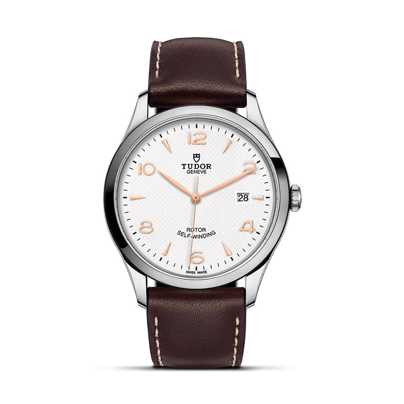 The TUDOR 1926 wristwatch features a white dial, gold hour markers, date display, stainless steel case, and brown leather strap—an elegant mechanical timepiece for discerning watch enthusiasts.