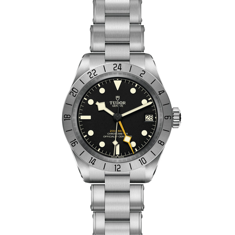The TUDOR Black Bay Pro is a stainless steel wristwatch with a black dial, silver bezel, luminescent hands and markers, date window at 3 o’clock, and metal bracelet—an iconic contemporary timepiece inspired by classic TUDOR divers’ watches.