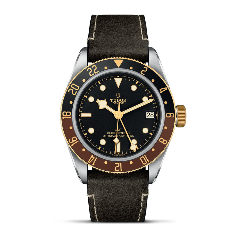 The TUDOR Black Bay GMT S&G features a black and gold bezel, black dial with yellow gold hour markers and hands, date at 3 oclock, and a sleek black leather strap—honoring classic TUDOR diver’s watch heritage.
